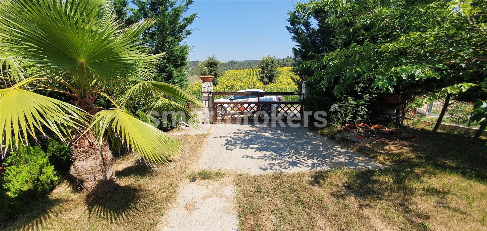 The house with its own yard located in a gated complex in the area of the town of Sani in Kassandra (Halkidiki)